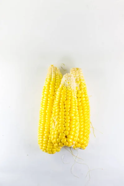 Three Piles Sweet Yellow Corn Isolated White Background — Stock Photo, Image