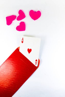 one heart in a red envelope and shades of pink heart on an isolated white background. 
