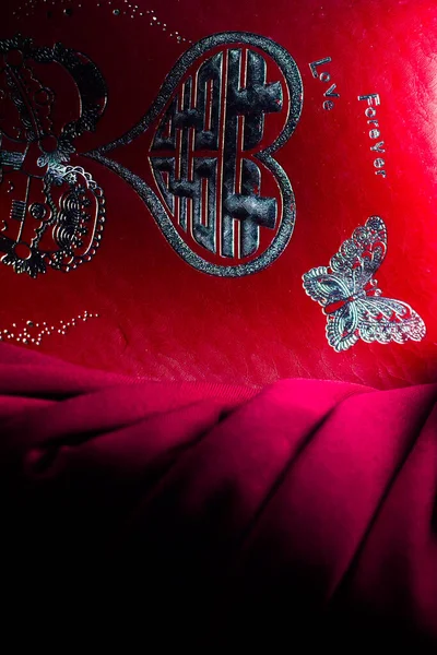 red envelope with gold butterfly ornament. South Kalimantan, Indonesia. January 6, 2022.