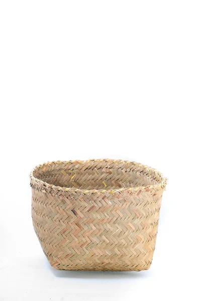 woven baskets of dry grass on an isolated white background. products made by local Indonesians. made from purun plant.