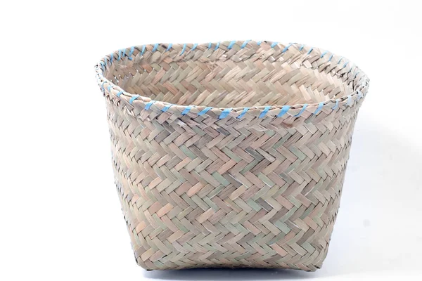 empty wicker basket with no contents on an isolated white background. baskets of dry grass, handmade by local Indonesians. copy space for products, handicrafts, traditional and local.