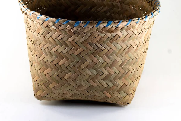 original hand woven basket on an isolated white background. baskets of dry grass, handmade by local Indonesians. copy space for products, handicrafts, traditional and local.