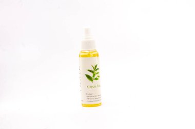 Hair tonic is made from green tea leaf extract. hair vitamins in a spray bottle on an isolated white background. South Kalimantan, Indonesia. June 06, 2022