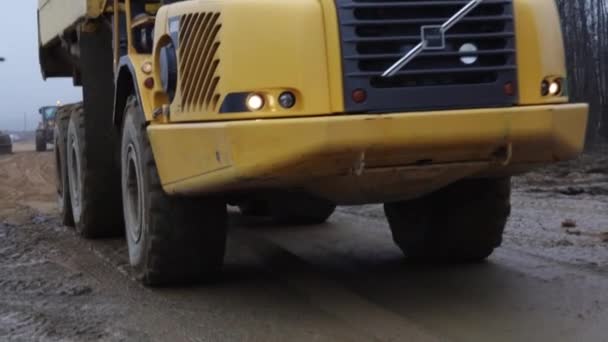 Yellow Truck Driving Dirt Road Large Wheels — Stock Video