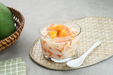 Mango Cheese Milk, a dessert made from jelly, nata de coco, basil seed, sweet mango, cream cheese and milk.
