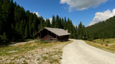 Landscape in the Alps with Hut and Grazing Cows - 5K