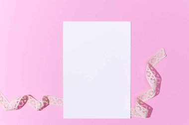 Mockup greeting card on pink background with vintage lace. St Valentine, Mothers Day, wedding holiday invitation. 