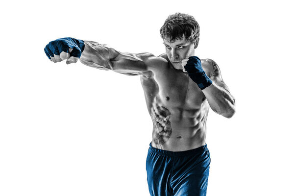 Portrait of Male boxer training and practicing jab. Isolated on white studio background. Concept of sport, healthy lifestyle. Black and white. Blue sportswear