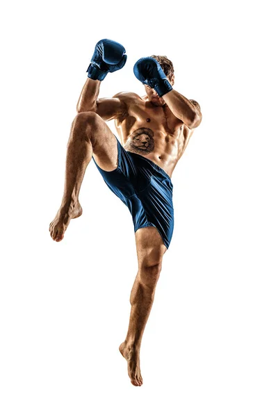 Full size of male kickboxer in blue sportswear on white background. muscular athlete fighting — Stock Photo, Image