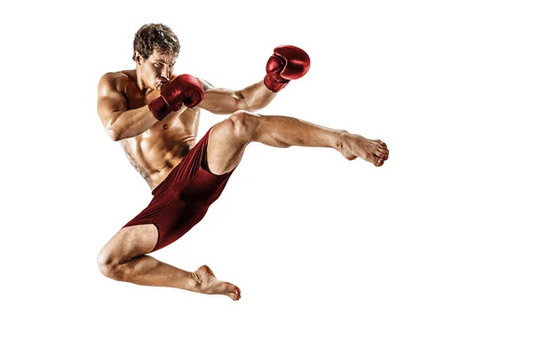 Full size of kickboxer who perform muay thai martial arts on white background. Red sportswear — Stock Photo, Image