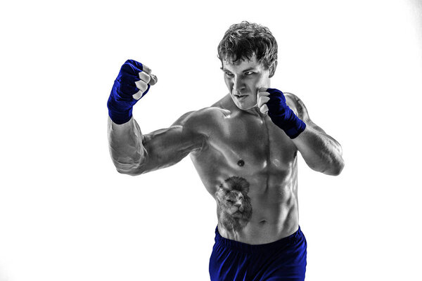 Studio Portrait of aggressive kickboxer training and practicing uppercut. Isolated on white studio background. Concept of sport, healthy lifestyle. Blue sportswear. Black and white silhouette