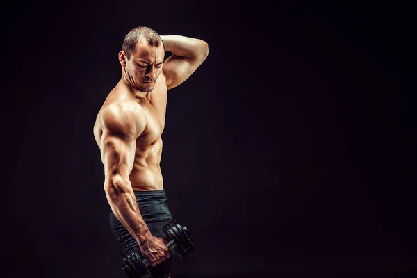 Perfectly Sculpted Strength. A Muscular Man Looking Down. Stock Photo,  Picture and Royalty Free Image. Image 194676756.