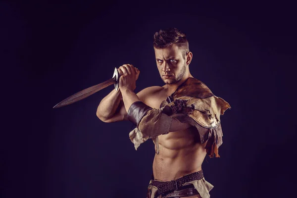 Portrait Handsome Muscular Gladiator Sword Isolated Studio Shot Dark Background — Stockfoto