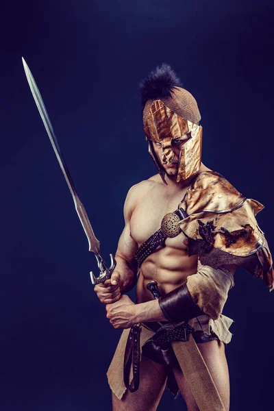 Portrait Handsome Muscular Gladiator Sword Isolated Studio Shot Dark Background — Stockfoto