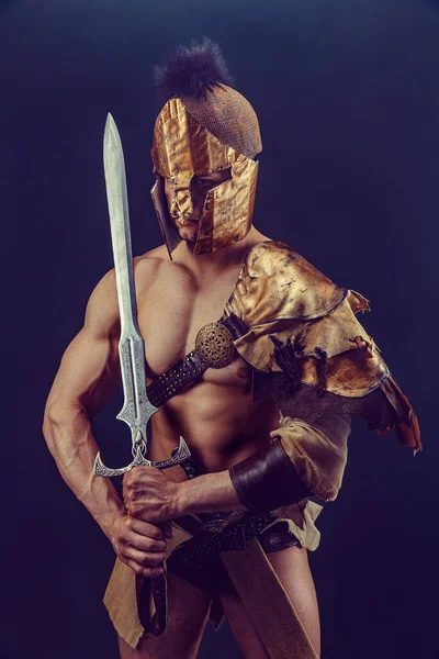 Portrait Handsome Muscular Gladiator Sword Isolated Studio Shot Dark Background — Foto Stock