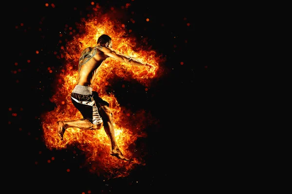 Fighter man in fire. Sport advertising. MMA boxer.