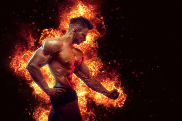 Brutal Strong Athletic Bodybuilder Posing Fire Spark Explosion Background Bodybuilding — Stock fotografie