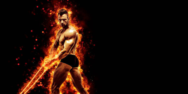Body builder with fit torso belly chest and arms biceps triceps muscles holding chain while posing over the black background with fire. Bodybuilding concept.