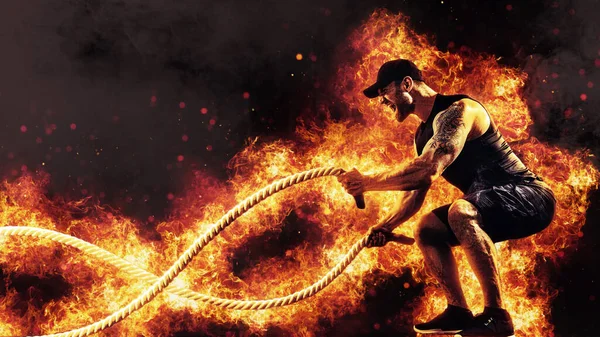 Muscular Man Working Out Battle Ropes Flame Background — Zdjęcie stockowe