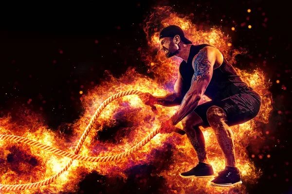 Muscular Man Working Out Battle Ropes Flame Background — Zdjęcie stockowe