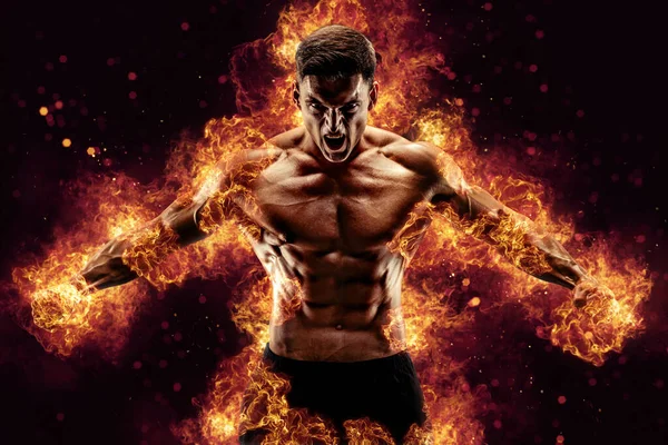 Bodybuilder Poseert Achtergrond Van Vlammen Hoge Kwaliteit Foto Rechtenvrije Stockfoto's