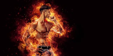 Yangın arka planında poz veren vücut geliştirici. Yüksek kalite fotoğraf