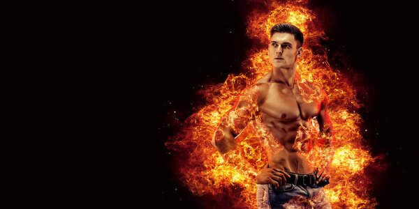 Bodybuilder posing on the fire flames background. High quality photo