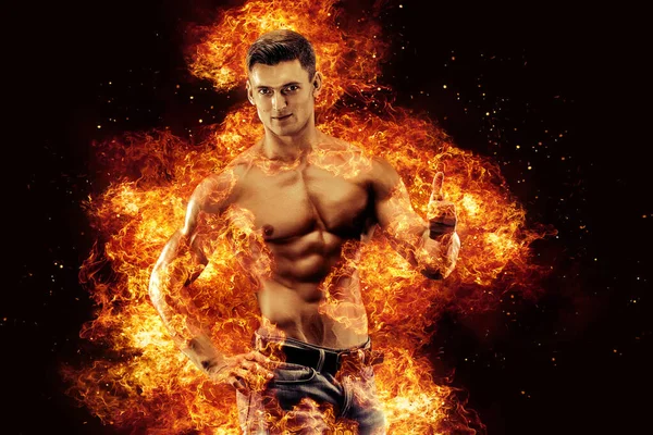 Bodybuilder posing on the fire flames background. High quality photo