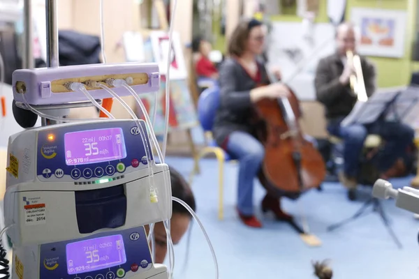 Hospital. Health and medicine.  Music therapy in children\'s ward.  France.