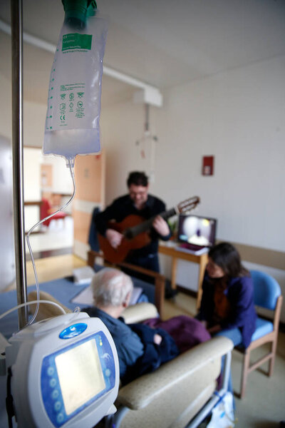Hospital. Health and medicine.  Music therapy in children's ward.  France. 