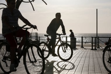 Seaside promenade at sunset. West Flanders. Belgium. 