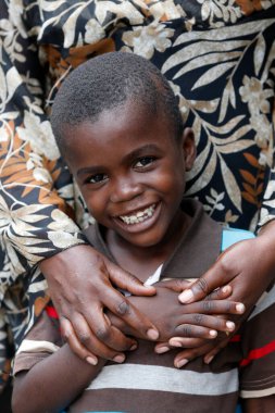 African boy with his mother.  Brazzaville. Congo. 