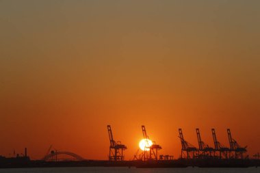 Container cranes at sunset.  United states of America. 