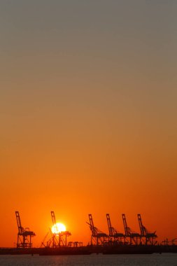 Container cranes at sunset.  United states of America. 