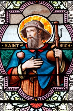 Aziz Roch. O köpeklerin koruyucu azizidir. Lekeli cam pencere. Combloux. Fransa. 