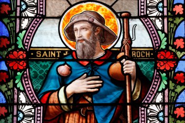 Aziz Roch. O köpeklerin koruyucu azizidir. Lekeli cam pencere. Combloux. Fransa. 