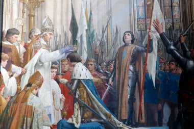 The Pantheon is the burial place for many famous French people.  Joan of Arc  at the coronation of Charles VII. painting by Jules-Eugene Lenepveu (1819-1898).  Paris. France. 