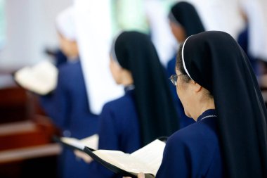 Dominican community.  Catholc nuns  at mass.   Bien Hoa. Vietnam. 