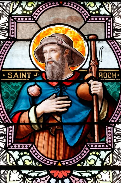Saint Roch. He is a patron saint of dogs. Stained glass window ...