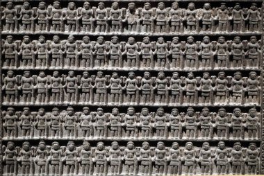 Asian Civilisations Museum. Angkor. Exploring Cambodia's sacred city.  Vishnu votive stele. On each side 255 small images of the four-armed Vishnu. Cambodia, 10th century. Sandstone. Singapore. 