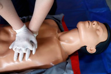 Life-saving first aid on a model.  Training session exercise.  Heart massage.  France. 