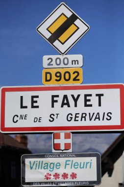 Village sign at Le Fayet in the French Alps. Village fleuri sign with 4 flowers.  France. 