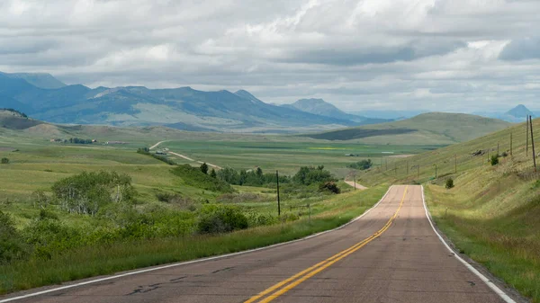 Two Lane Road Stretches Far Distance Hills Western Montana — 图库照片