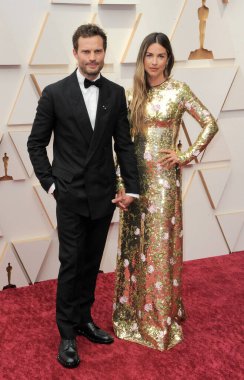 Jamie Dornan ve Amelia Warner, 27 Mart 2022 'de ABD' nin Los Angeles kentindeki Dolby Tiyatrosu 'nda düzenlenen 94..