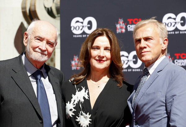 Christoph Waltz supports producers Michael G. Wilson and Barbara Broccoli at their handprints ceremony at the TCL Chinese Theatre in Hollywood, USA on September 21, 2022.