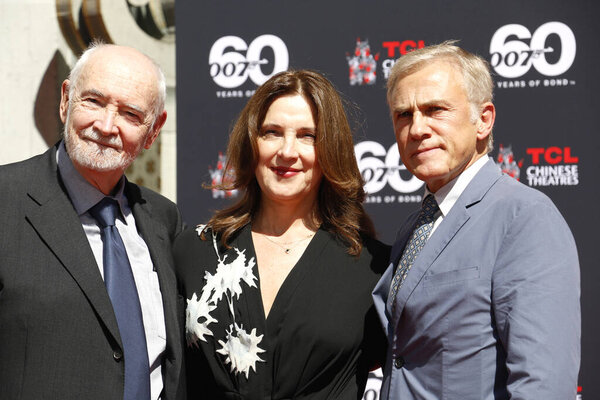 Christoph Waltz supports producers Michael G. Wilson and Barbara Broccoli at their handprints ceremony at the TCL Chinese Theatre in Hollywood, USA on September 21, 2022.