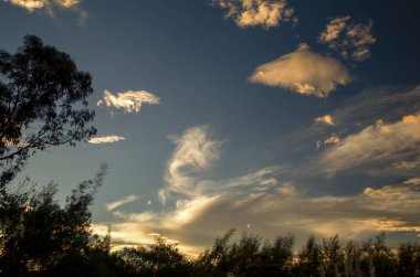 Multiple exposure composite of an eclectic collection of clouds at sunset, near the colonial town of Villa de Leyva in central Colombia.