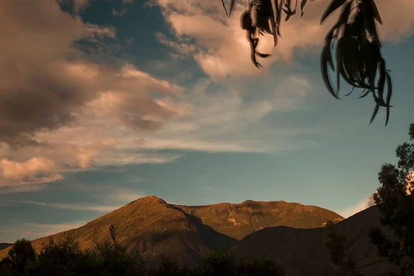 The light of the sunset and the shadows of the clouds over the Iguaque mountain in the eastern Andes range of central Colombia.