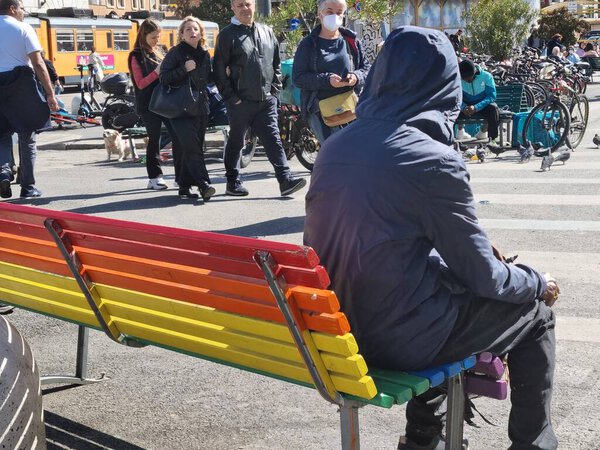 Italy, milan. rainbow bench for the peace in the city center