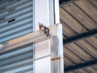 Close-up of sliding rails of stainless steel doors entrance to the house